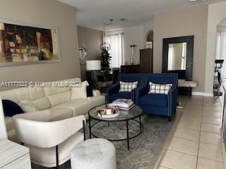 4833 NW 108th Path, Doral, FL 33178 - tiled living room with arched walkways and baseboards