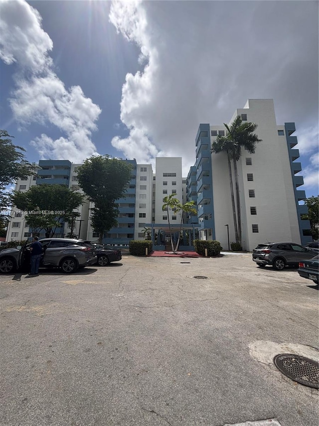 view of property featuring uncovered parking
