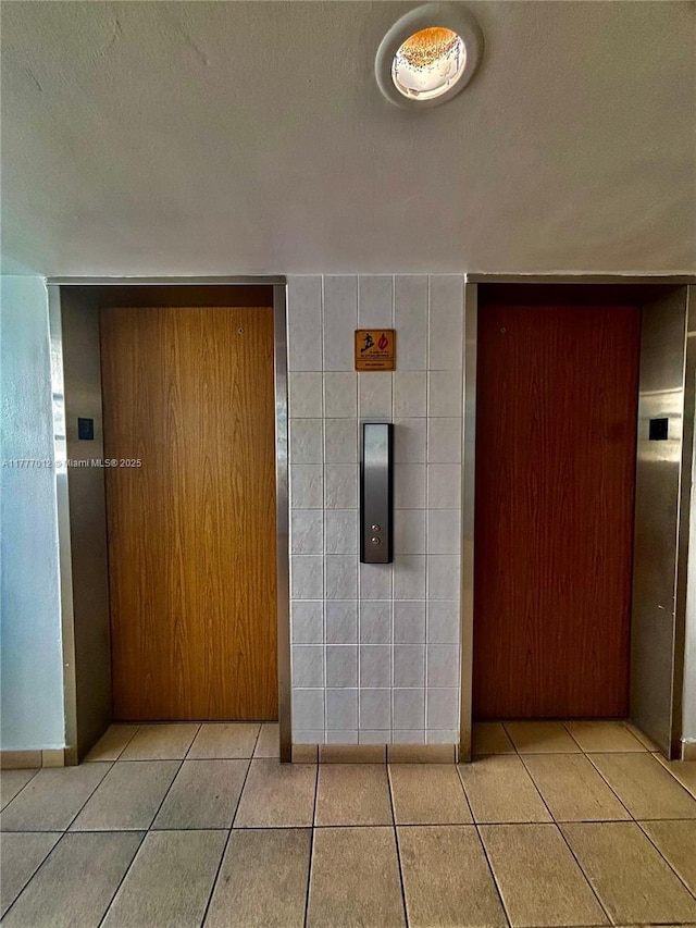 entrance to property featuring elevator