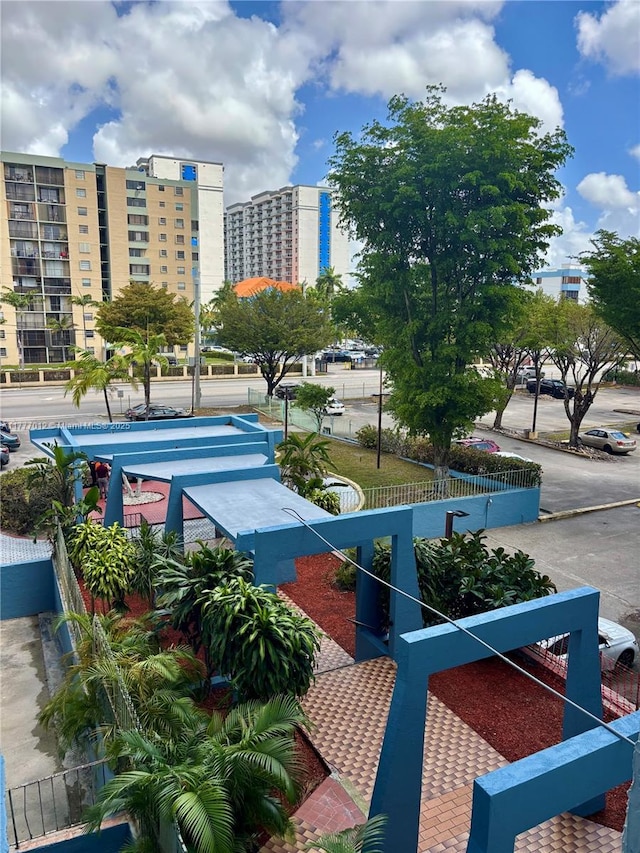 view of property's community featuring fence