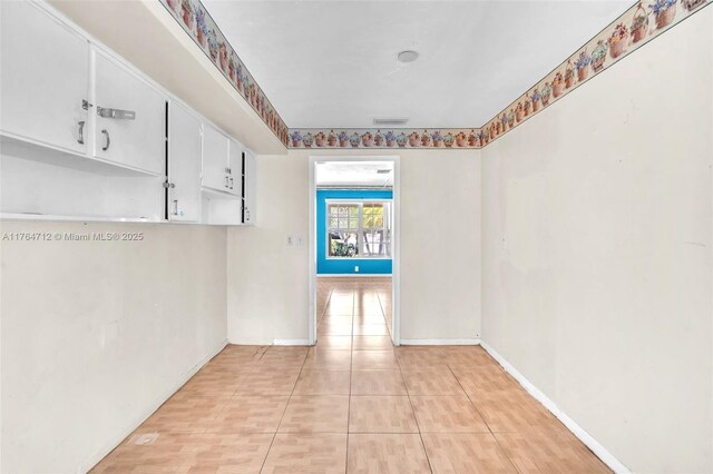 1910 NE 56th St, Fort Lauderdale, FL 33308 - spare room with baseboards and light tile patterned floors