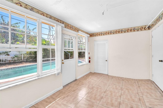 1910 NE 56th St, Fort Lauderdale, FL 33308 - spare room featuring healthy amount of natural light and light tile patterned floors