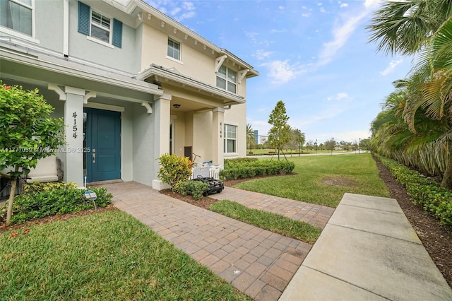 4154 Greenway Dr, Hollywood, FL 33021 - property entrance featuring stucco siding and a lawn