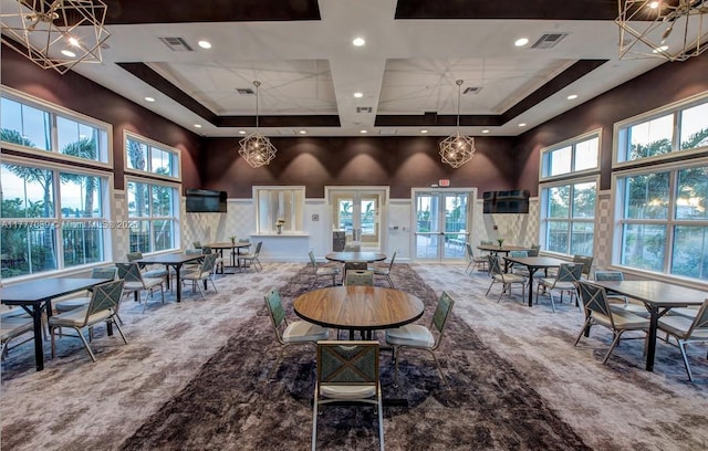 4154 Greenway Dr, Hollywood, FL 33021 - carpeted dining area with a towering ceiling, visible vents, and a raised ceiling
