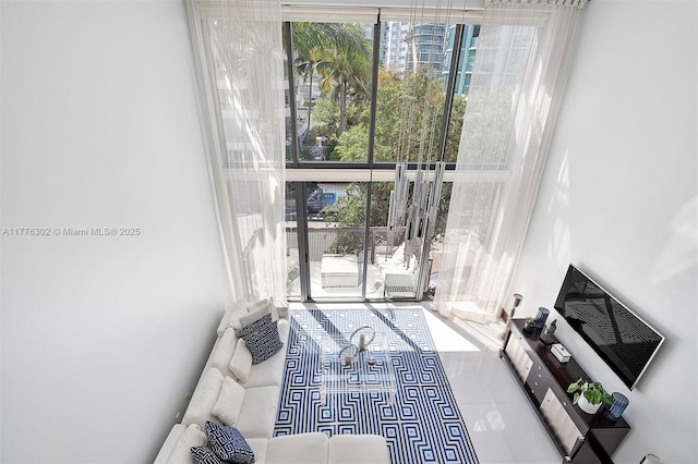 doorway to outside with tile patterned floors and plenty of natural light
