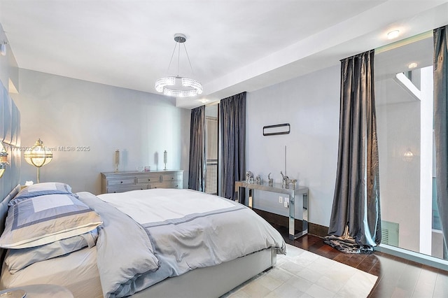 bedroom with wood finished floors