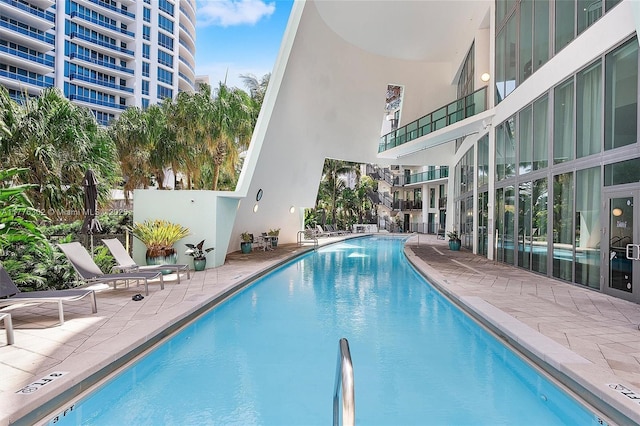 community pool featuring a patio area