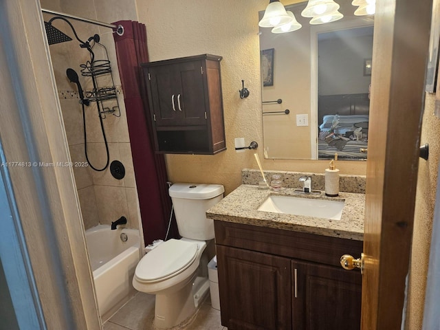 bathroom with toilet, vanity, shower / tub combo with curtain, a textured wall, and tile patterned flooring