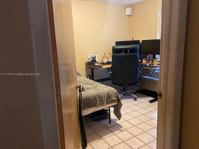 bedroom with light tile patterned floors