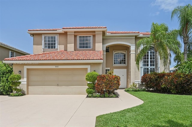 9145 Picot Ct, Boynton Beach, FL 33472 - mediterranean / spanish home featuring concrete driveway, stucco siding, a tile roof, a front yard, and a garage