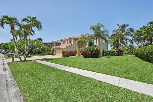 9145 Picot Ct, Boynton Beach, FL 33472 - mediterranean / spanish-style home with driveway, a front lawn, and stucco siding