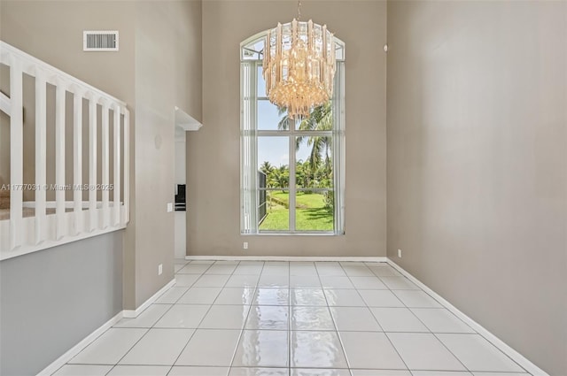 9145 Picot Ct, Boynton Beach, FL 33472 - tiled entryway featuring a chandelier and baseboards
