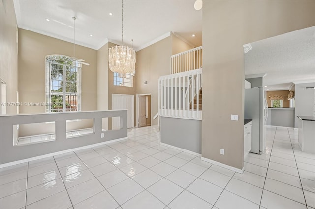 9145 Picot Ct, Boynton Beach, FL 33472 - spare room featuring ornamental molding, light tile patterned flooring, baseboards, a chandelier, and recessed lighting