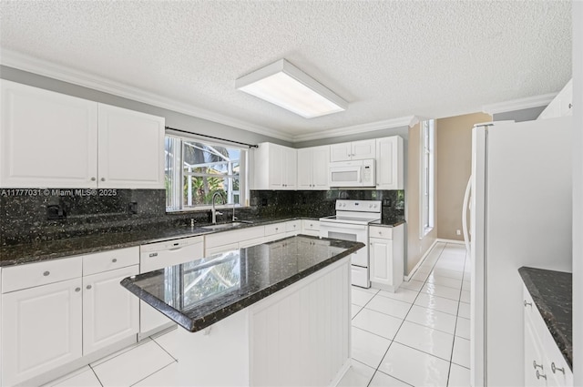 9145 Picot Ct, Boynton Beach, FL 33472 - kitchen featuring white appliances, a sink, ornamental molding, white cabinetry, and tasteful backsplash