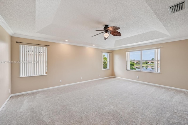 9145 Picot Ct, Boynton Beach, FL 33472 - spare room with a tray ceiling, a ceiling fan, a textured ceiling, ornamental molding, and carpet floors