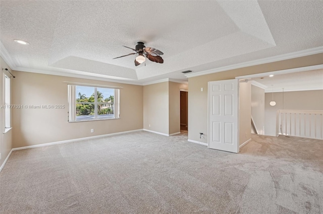 9145 Picot Ct, Boynton Beach, FL 33472 - empty room featuring a tray ceiling, a ceiling fan, a textured ceiling, carpet, and crown molding