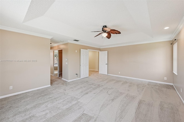9145 Picot Ct, Boynton Beach, FL 33472 - carpeted empty room with ornamental molding, a ceiling fan, a textured ceiling, baseboards, and a tray ceiling