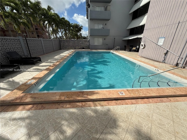 495 NW 72nd Ave Unit 305, Miami, FL 33126 - community pool featuring fence and a patio area