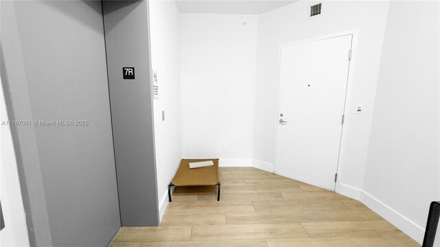 16385 Biscayne Blvd Unit 707, North Miami Beach, FL 33160 - corridor with light wood finished floors and baseboards