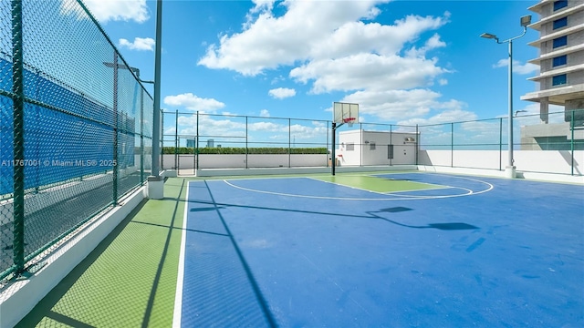 view of sport court featuring fence and community basketball court