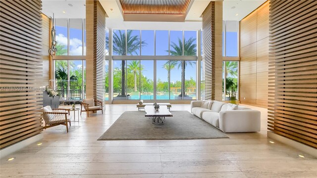 16385 Biscayne Blvd Unit 707, North Miami Beach, FL 33160 - living area with a towering ceiling and expansive windows
