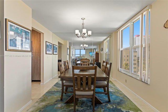 living room featuring visible vents, baseboards, and a ceiling fan
