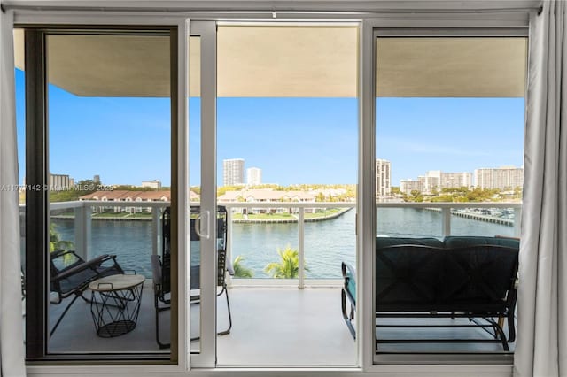 interior space with a water view and a city view