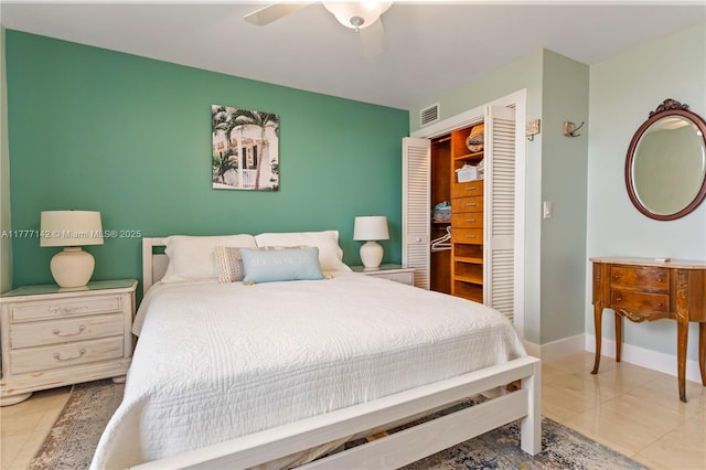 bedroom with visible vents, baseboards, a closet, a ceiling fan, and tile patterned flooring