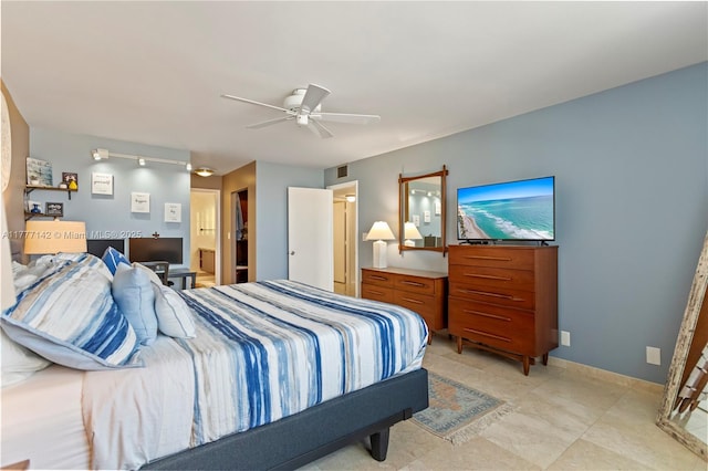 bedroom featuring baseboards, a ceiling fan, and visible vents