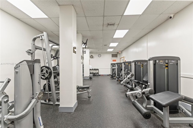 gym featuring visible vents and a drop ceiling