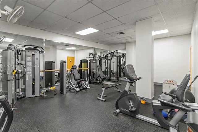exercise room featuring a drop ceiling and visible vents