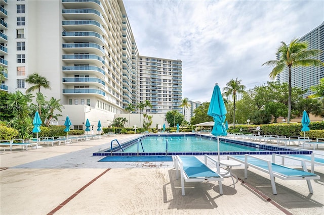 pool featuring a patio area and fence