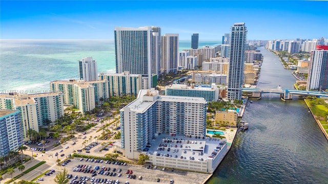 drone / aerial view featuring a water view and a city view