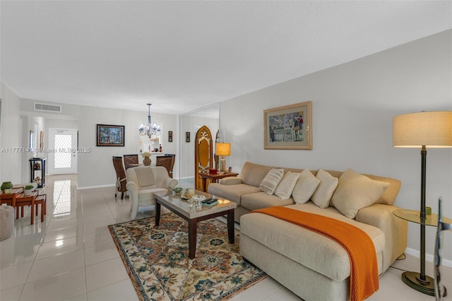 14773 Cumberland Dr Unit 208, Delray Beach, FL 33446 - living area with a chandelier, light tile patterned floors, and baseboards