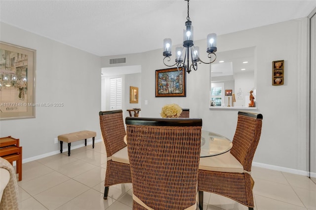 14773 Cumberland Dr Unit 208, Delray Beach, FL 33446 - dining room with a chandelier, light tile patterned floors, and baseboards