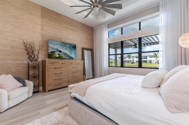 bedroom featuring light wood-style floors and ceiling fan