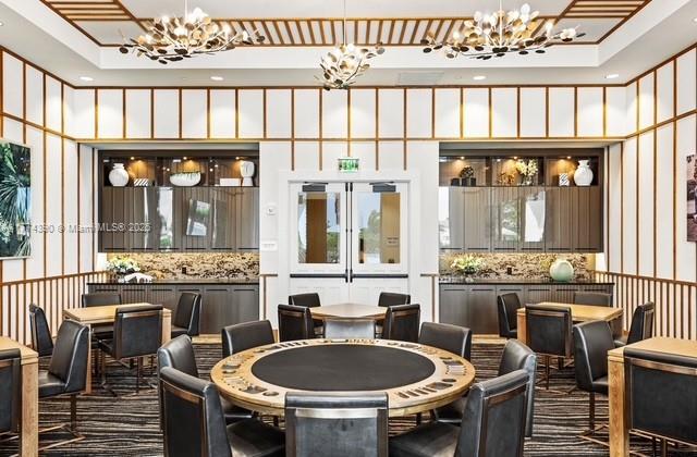 dining area featuring a notable chandelier