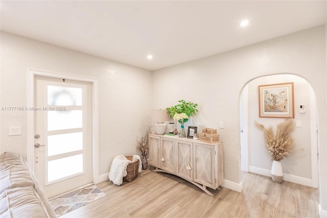 6250 SW 19th St, Miami, FL 33155 - entryway with arched walkways, baseboards, light wood-style flooring, and recessed lighting