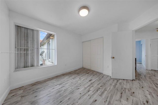 12302 NW 11th St Unit 1402, Miami, FL 33182 - empty room featuring wood finished floors, baseboards, and a ceiling fan