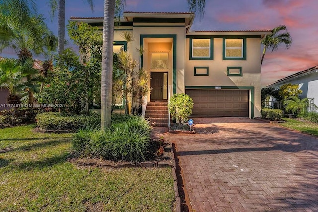 16226 Opal Creek Dr, Weston, FL 33331 - view of front of home with a tiled roof, stucco siding, decorative driveway, and a garage