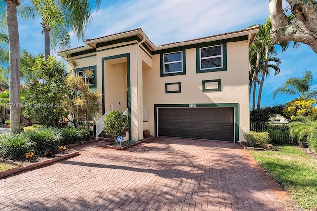 16226 Opal Creek Dr, Weston, FL 33331 - view of front of property featuring stucco siding, a garage, fence, and decorative driveway