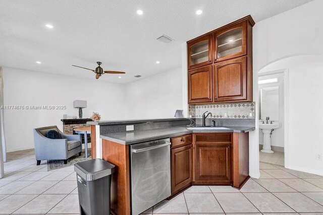 16226 Opal Creek Dr, Weston, FL 33331 - kitchen featuring stainless steel dishwasher, light tile patterned floors, ceiling fan, a sink, and decorative backsplash