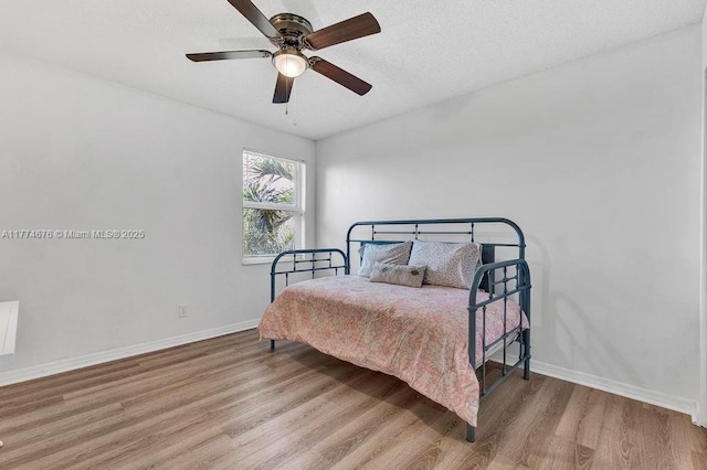 16226 Opal Creek Dr, Weston, FL 33331 - bedroom featuring baseboards, a ceiling fan, and wood finished floors