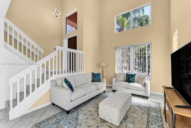 16226 Opal Creek Dr, Weston, FL 33331 - tiled living room featuring baseboards, stairs, a notable chandelier, and a high ceiling