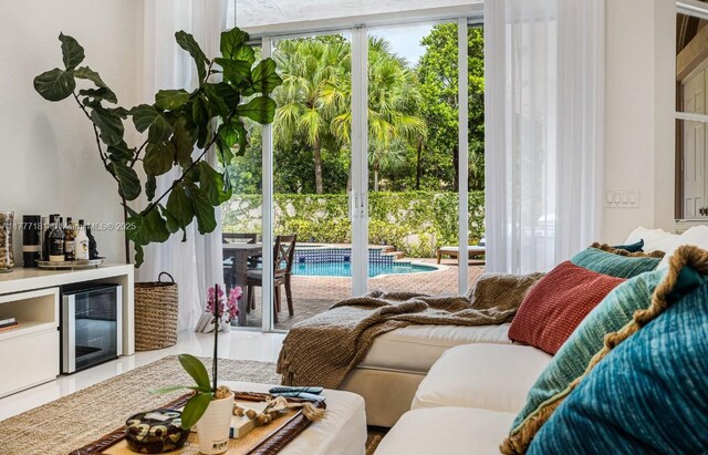 1604 Victoria Pointe Ln, Weston, FL 33327 - living room featuring wine cooler, healthy amount of natural light, and bar