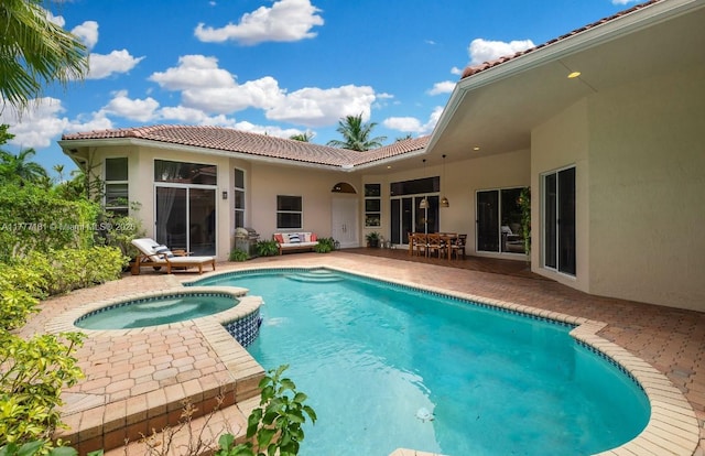 1604 Victoria Pointe Ln, Weston, FL 33327 - view of swimming pool with a patio area and a pool with connected hot tub