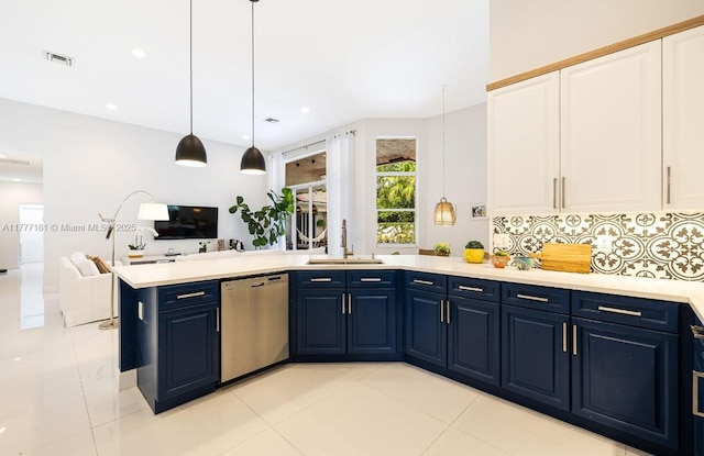 1604 Victoria Pointe Ln, Weston, FL 33327 - kitchen with dishwasher, blue cabinetry, light countertops, open floor plan, and white cabinets