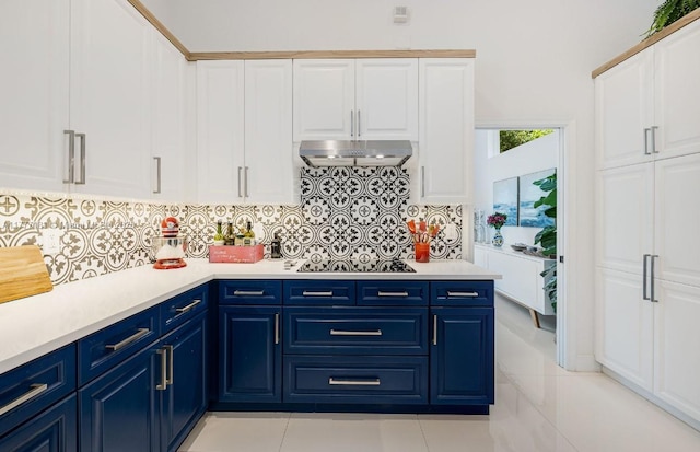 1604 Victoria Pointe Ln, Weston, FL 33327 - kitchen featuring ventilation hood, blue cabinets, light countertops, and tasteful backsplash