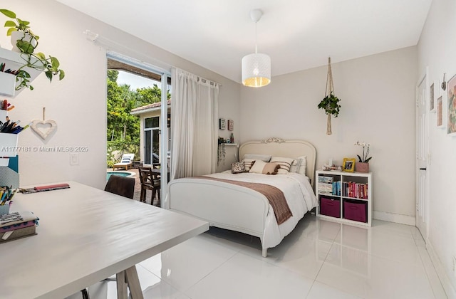 1604 Victoria Pointe Ln, Weston, FL 33327 - bedroom featuring access to exterior and light tile patterned flooring