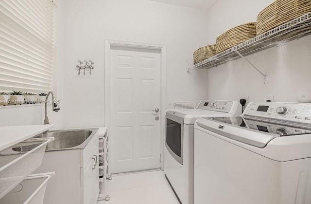 1604 Victoria Pointe Ln, Weston, FL 33327 - washroom featuring washing machine and clothes dryer and light tile patterned floors